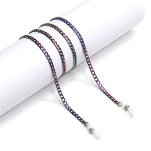 Rainbow metal eyeglasses chain with anti-slip silicone loops on a white display stand