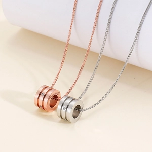Polished titanium steel cylinder pendants with pavé zircons in rose gold and silver finish