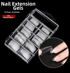 Detailed view of 100pcs clear nail extension forms in a divided plastic storage box