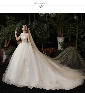 Close-up of exquisite lace embroidery and luxury beaded details on white wedding gown