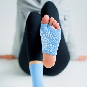 Blue knit half-toe yoga socks with non-slip grip dots for Pilates and dance workouts
