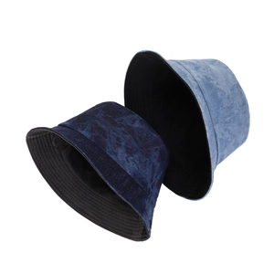 Vintage tie-dye denim bucket hats for women in dark and light blue with reversible design