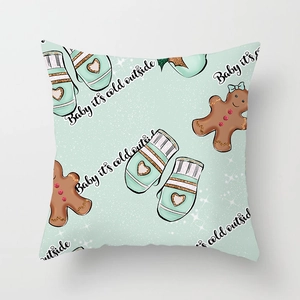 Christmas pillow cover with gingerbread and Baby it's cold outside text on green fabric