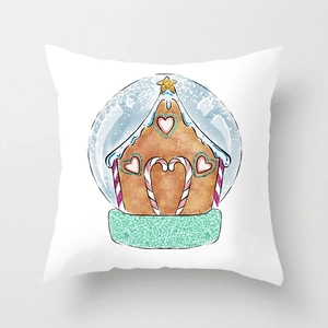 Detail shot of a white Christmas pillowcase featuring a festive gingerbread house snow globe