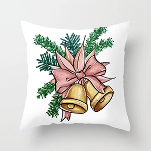 Detail of Christmas pillowcase featuring golden bells, pink bow and festive greenery design