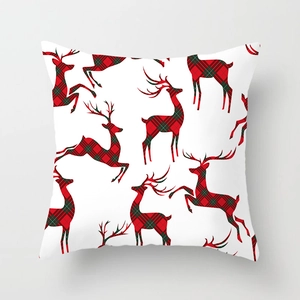 Christmas pillowcase featuring a red and green plaid reindeer silhouette on white fabric