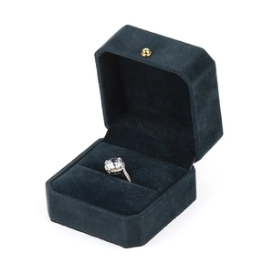 Premium dark blue velvet octagonal jewelry box with a large round diamond ring inside