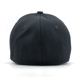 Detail view of the breathable mesh fabric and reinforced stitching on a black baseball cap