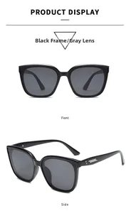 Detail view of retro square black sunglasses with silver accents and gray lenses