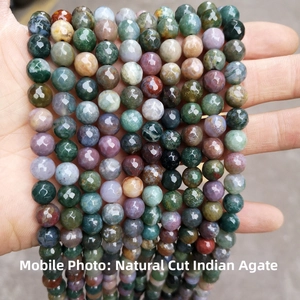 Close-up of natural faceted Indian agate beads showing multi-color mineral textures