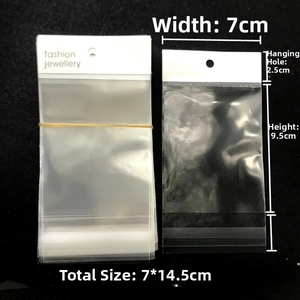 Detail of transparent OPP self-adhesive bag with white fashion jewelry header card