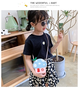 Detail of mushroom house shaped crossbody bag for kids with blue polka dot roof and pink base
