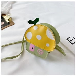Detail view of mushroom-shaped kids crossbody bag with vibrant yellow and green PU material