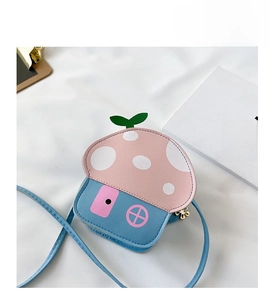 Detail of pink mushroom house child crossbody bag with white dots and blue base