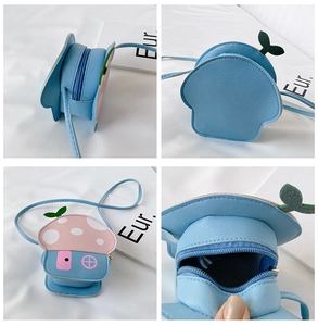 Detail view of mushroom shaped crossbody bag in blue and pink with polka dots
