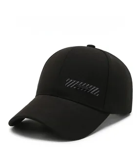 Detailed view of black cotton baseball cap featuring silver striped embroidery and metal tag