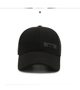Close-up of a black cotton baseball cap showing twill fabric and silver stripe design