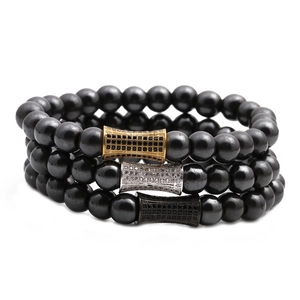 Set di tre bracciali di perline in ematite nera con ciondoli pavé oro argento e nero