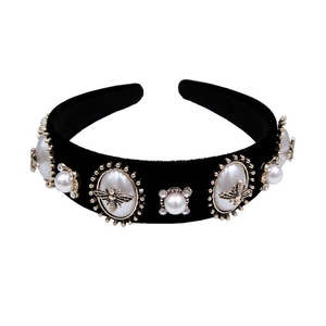 Elegant black velvet headband featuring faux pearl embellishments and metal bee accents