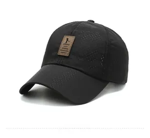 Close-up of black breathable baseball cap featuring laser-cut holes and leather patch