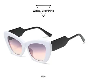 Seitenansicht der Cat-Eye-Sonnenbrille mit weißem Rahmen und grau-rosa Verlaufsglas
