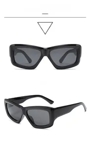 Detailed front and side view of chunky black rectangle sunglasses with dark gray lenses