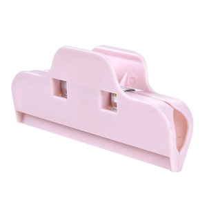 Light pink plastic food bag sealer clip with metal spring for kitchen storage