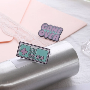 Cute retro Game Over and gamepad enamel pins set for bags and clothing decoration