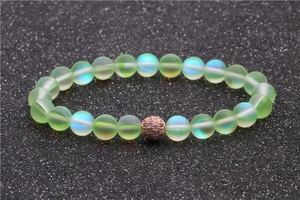 Frosted light green moonstone bead bracelet with rose gold zircon ball on black sand