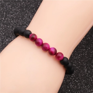 Black matte tiger eye beaded bracelet for men and women on a black display background