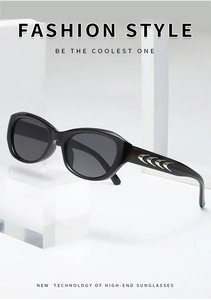 Vue détaillée de lunettes de soleil œil-de-chat noires avec inserts en métal