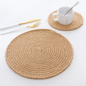 Detail of round jute placemats with spiral weave texture for heat insulation