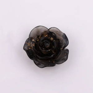22mm black translucent resin rose with gold foil flakes on white background
