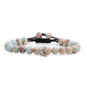 Braided imperial stone bead bracelet featuring a silver crown charm on a white background