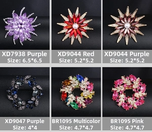 Detailed grid of crystal alloy brooches in various colors and starburst floral shapes