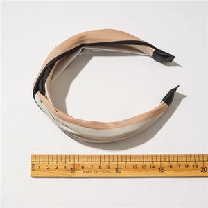 Contrast color fabric headband in beige and grey with ruler measurement for size