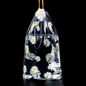 Frosted PE plastic drawstring bag with daisy pattern showing waterproof performance