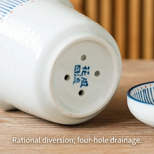 Japanese ceramic chopstick holder with four drainage holes and hand-painted floral mark