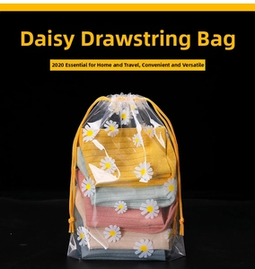 Close-up of frosted drawstring storage bag featuring daisy prints for travel organization