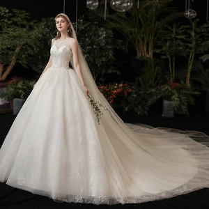 Elegant white lace wedding dress with ball gown silhouette and luxury long train