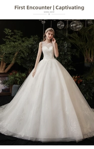 Detail of bridal dress with lace bodice, sequin embellishments and sparkling tulle skirt