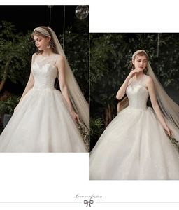 Detail of white ball gown featuring sleeveless lace bodice and textured jacquard fabric
