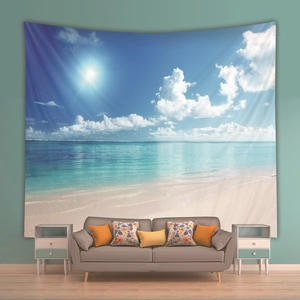 Detail showing tropical beach landscape tapestry on mint green wall above a sofa
