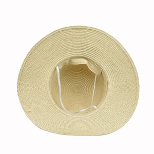 Detail view of woven beige straw hat interior with adjustable windproof chin strap