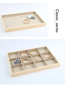 Detail of wooden jewelry tray with classic series engraving and soft beige velvet interior