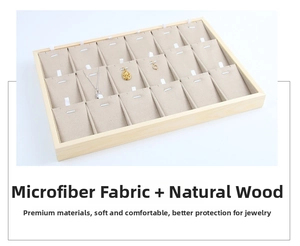 Close-up of wooden necklace display tray with 18 compartments and beige microfiber lining