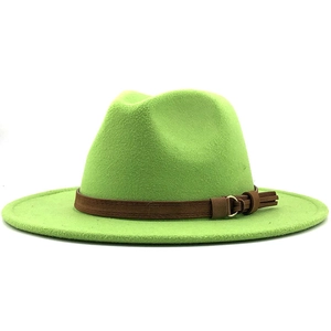 Detail of bright green fedora hat with a brown faux leather band and metal buckle