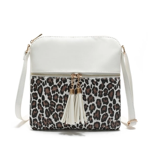 Chic crossbody bag with leopard print stitching and double tassel charm decoration