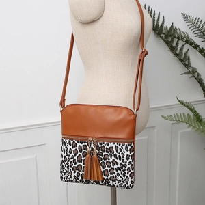 Women's crossbody bag with leopard print patchwork and stylish double leather tassels