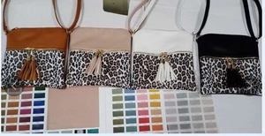 Detail of leopard print crossbody bags in four colors with long fringe tassels